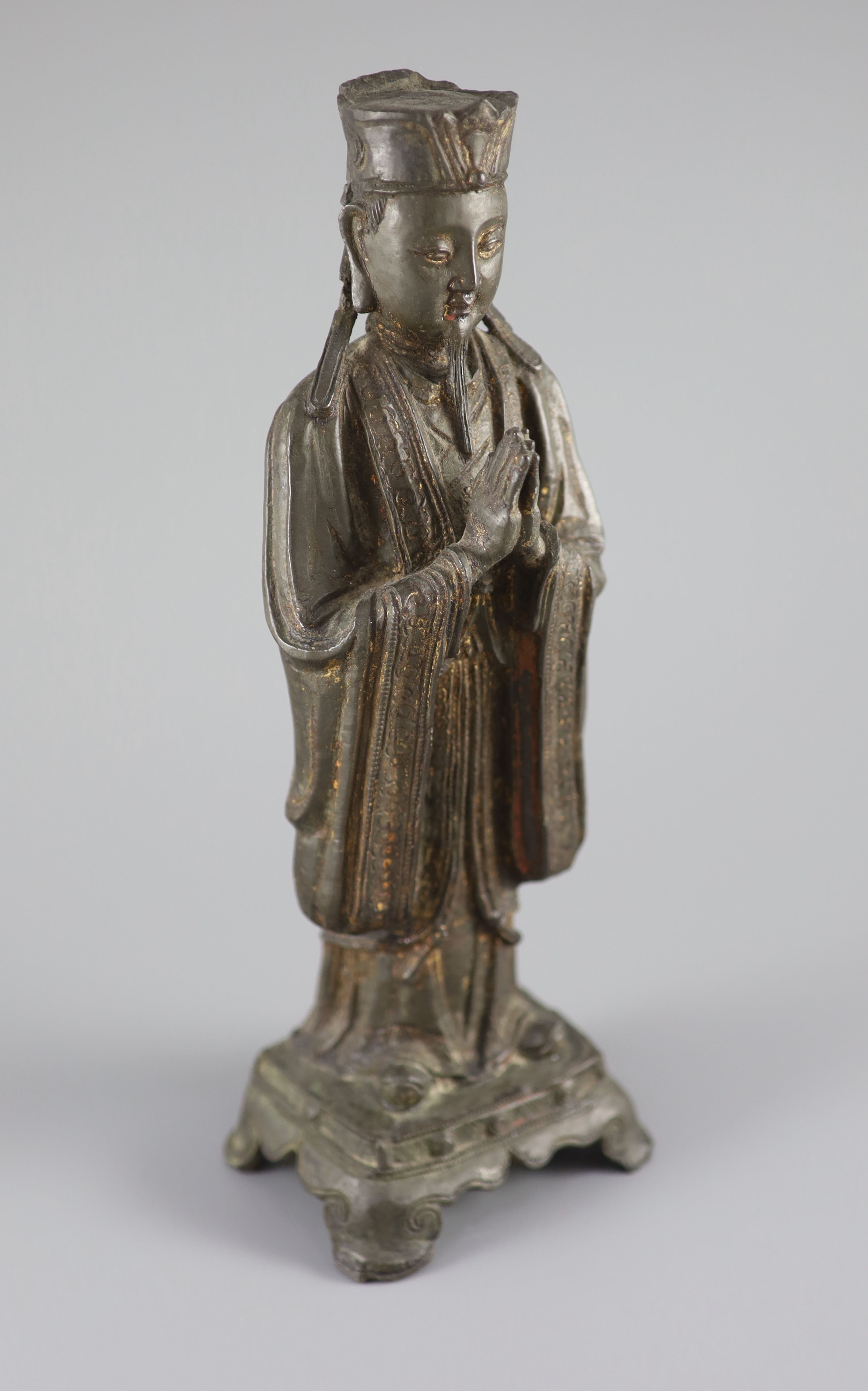 A Chinese bronze standing figure of an immortal, late Ming, 17th century, 31.3 cm high